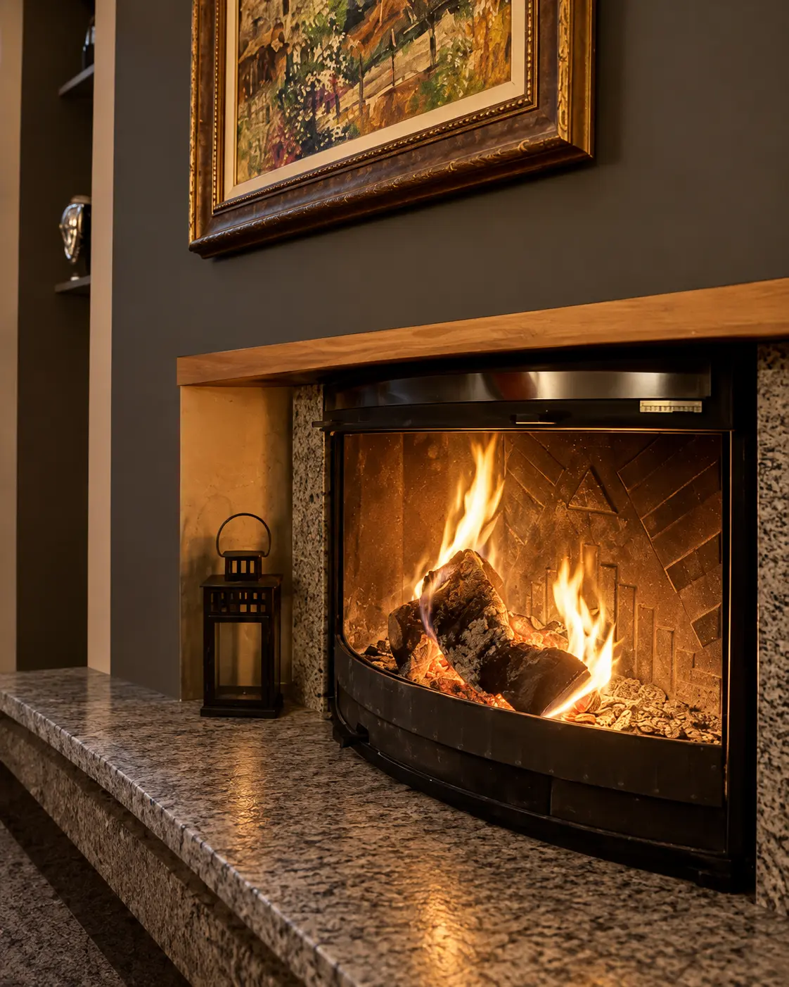 A lit fireplace and a small lantern on a stone hearth